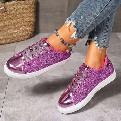 Magenta pink sequin lace-up board shoes with white rubber sole, low profile.
