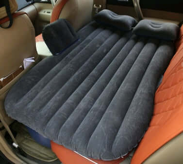Dark gray ribbed inflatable car mattress with two raised pillows
