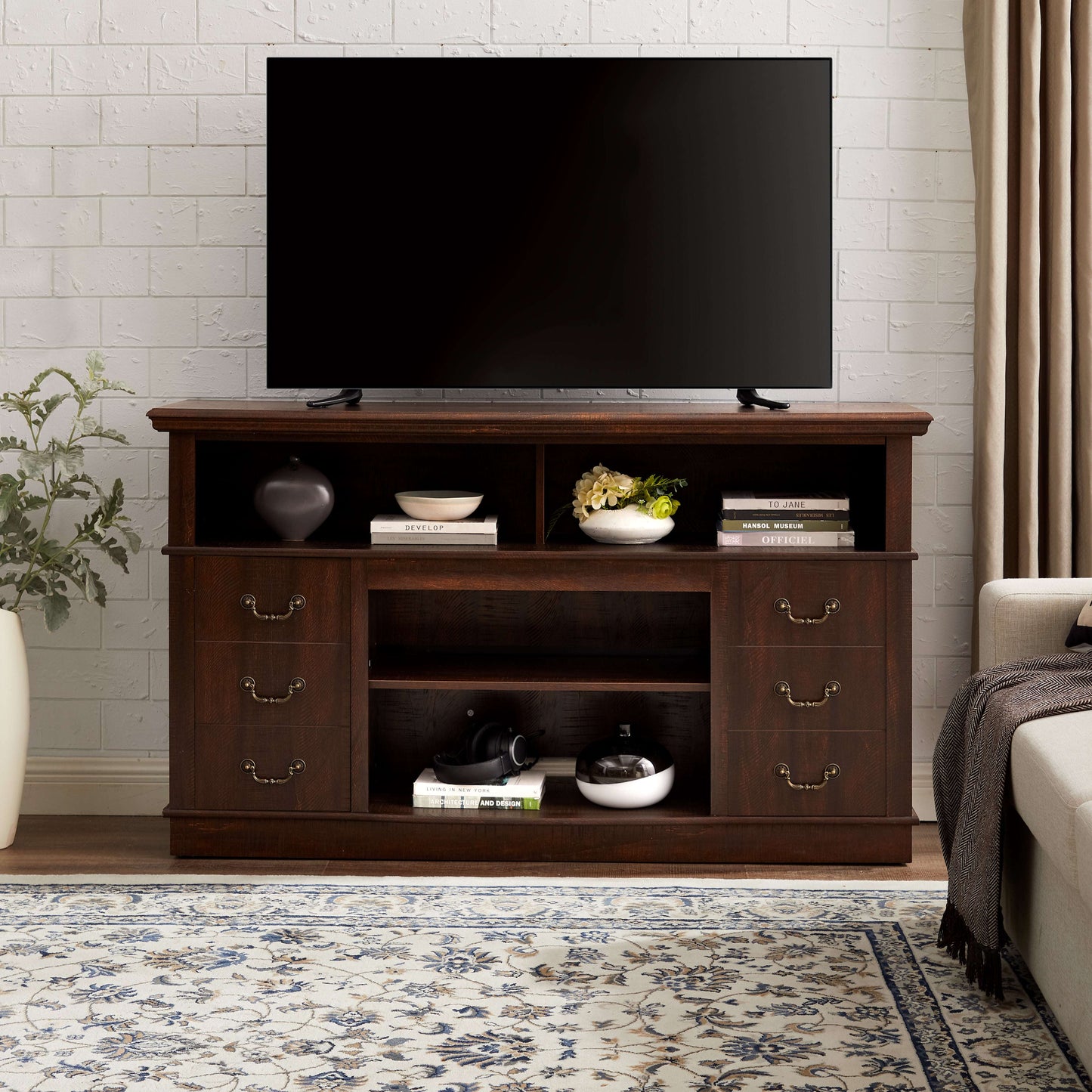 Espresso TV stand with central open shelves, side cabinets, and decorative metal pulls