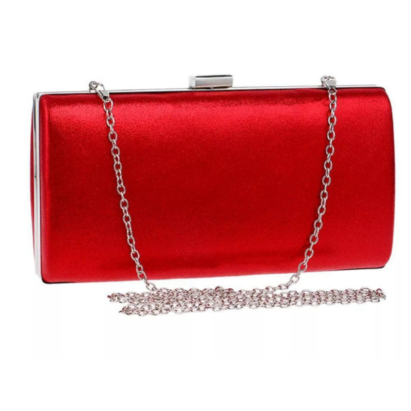 Red evening clutch bag with metal frame clasp and chain strap