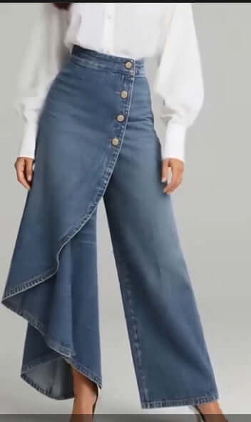 Blue denim straight-leg pants with asymmetrical ruffle overlay and front buttons