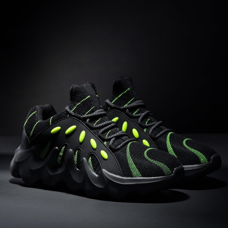 Breathable mesh sneakers in black with neon green accents and chunky molded sole