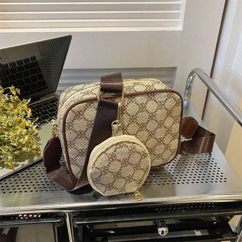 Tan patterned shell crossbody bag with long strap and round front pouch