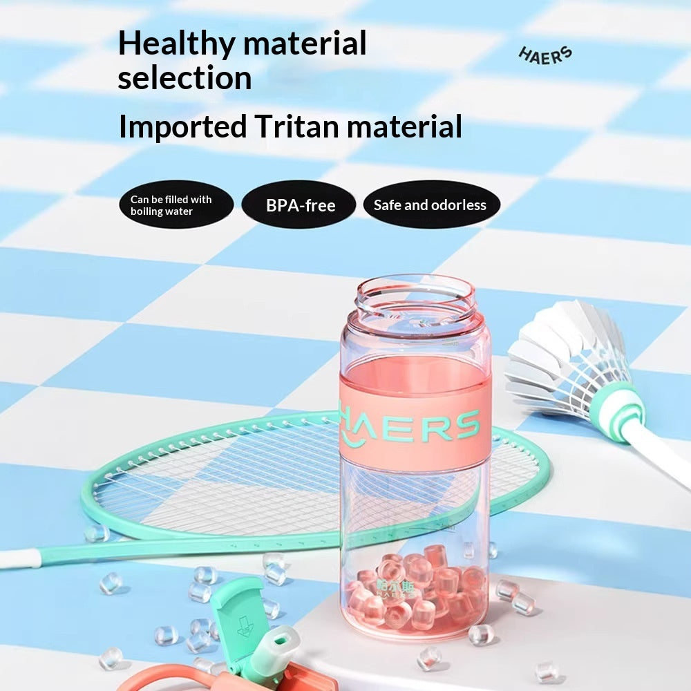 Transparent BPA-free Tritan water bottle with pink lid and straw opening