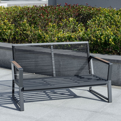 Dark grey patio loveseat with woven backrest, armrests, and thick seat cushions