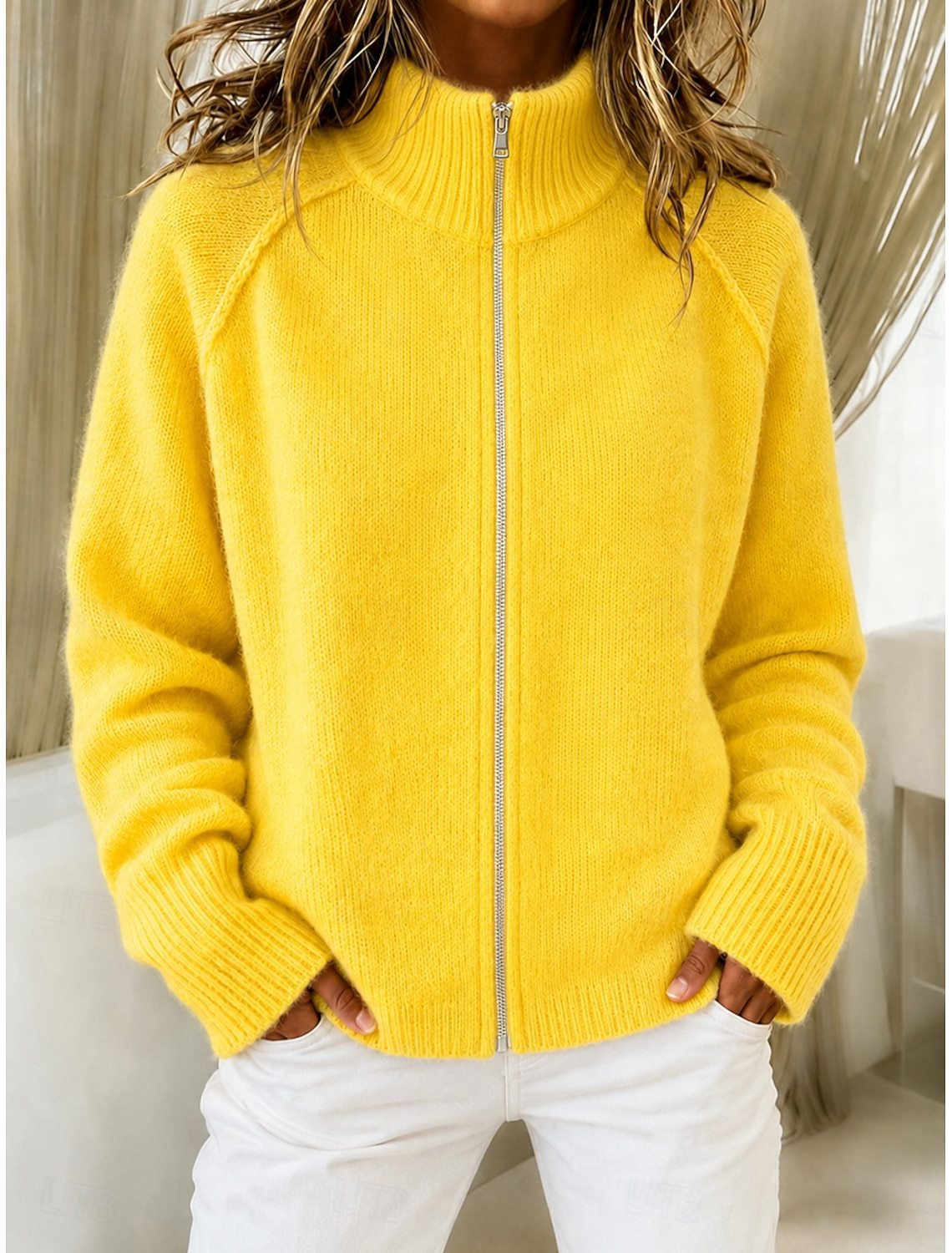 Yellow knitted cardigan with stand collar and front zipper, long sleeves, ribbed cuffs