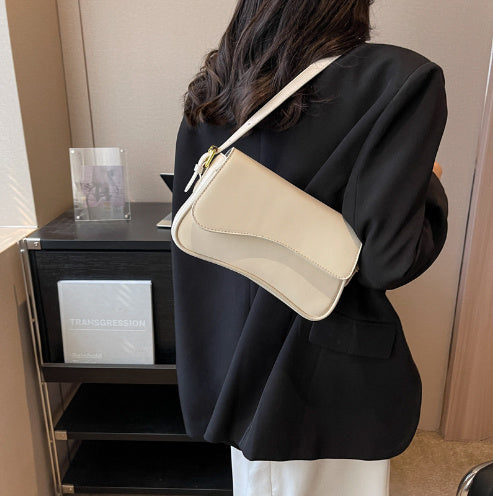 Cream shoulder bag with flap and magnetic buckle, gold-tone clasp, adjustable strap