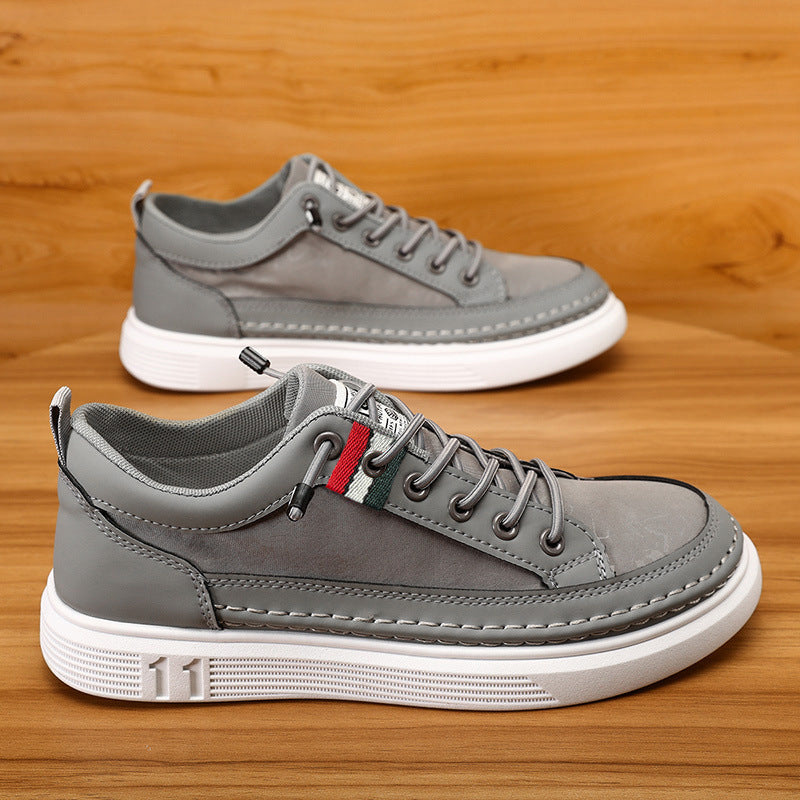 Men's canvas sneaker in light gray with multicolor stripe at tongue and white sole