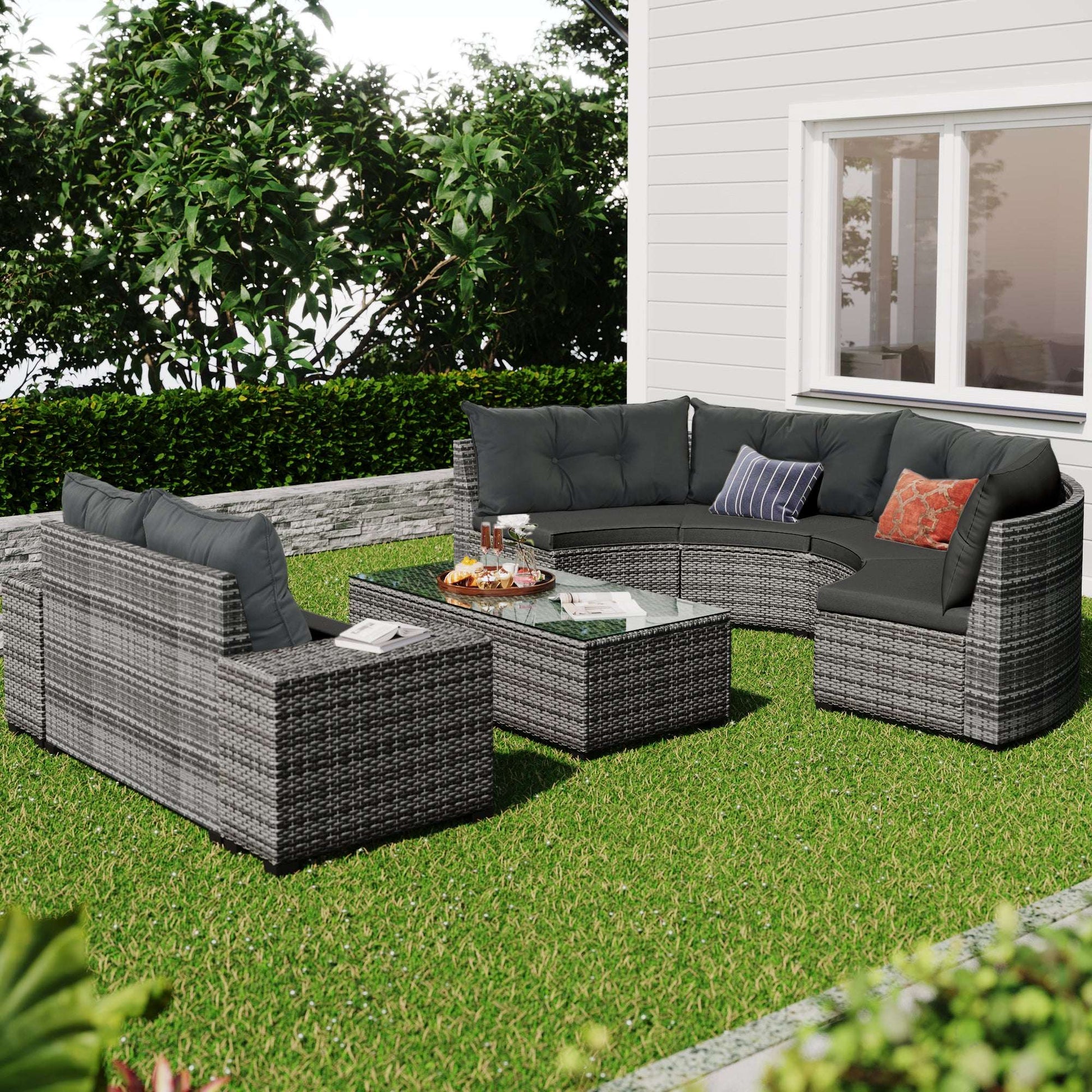 Gray outdoor wicker sectional sofa set with tufted cushions and rectangular coffee table