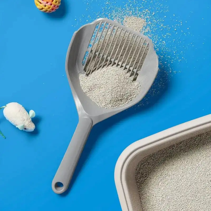 Grey plastic litter scoop with ridged sifting head and loop handle