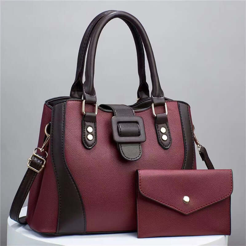 Red tote bag with black side panel and matching envelope clutch pouch