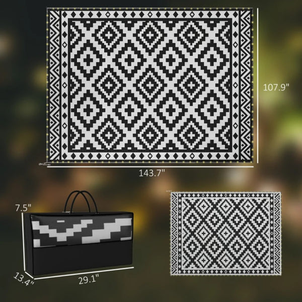 Geometric outdoor rug with bold black and white diamond lattice pattern