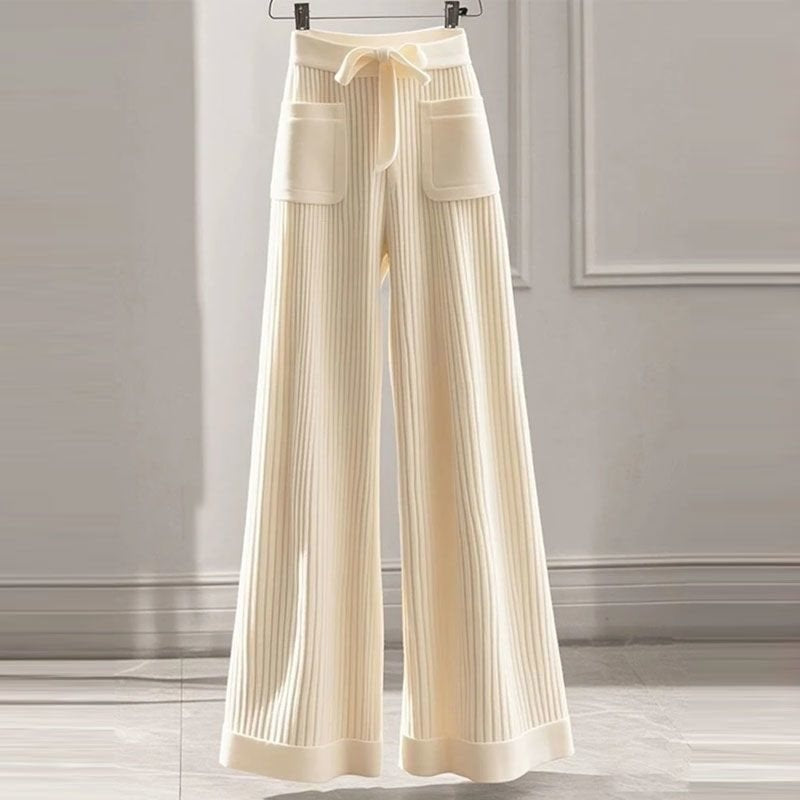 Cream ribbed straight-leg knit pants with front patch pockets and drawstring waist