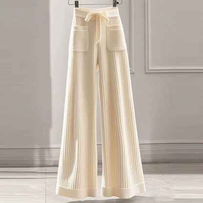 Cream ribbed straight-leg knit pants with front patch pockets and drawstring waist
