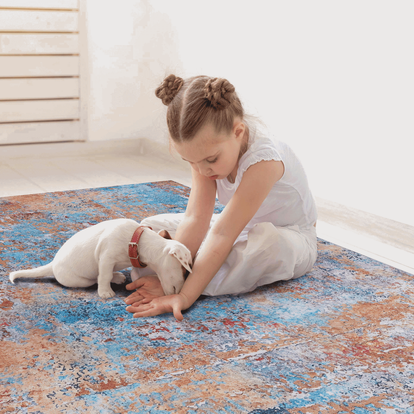 Washable indoor area rug in blue, orange, and gray abstract pattern