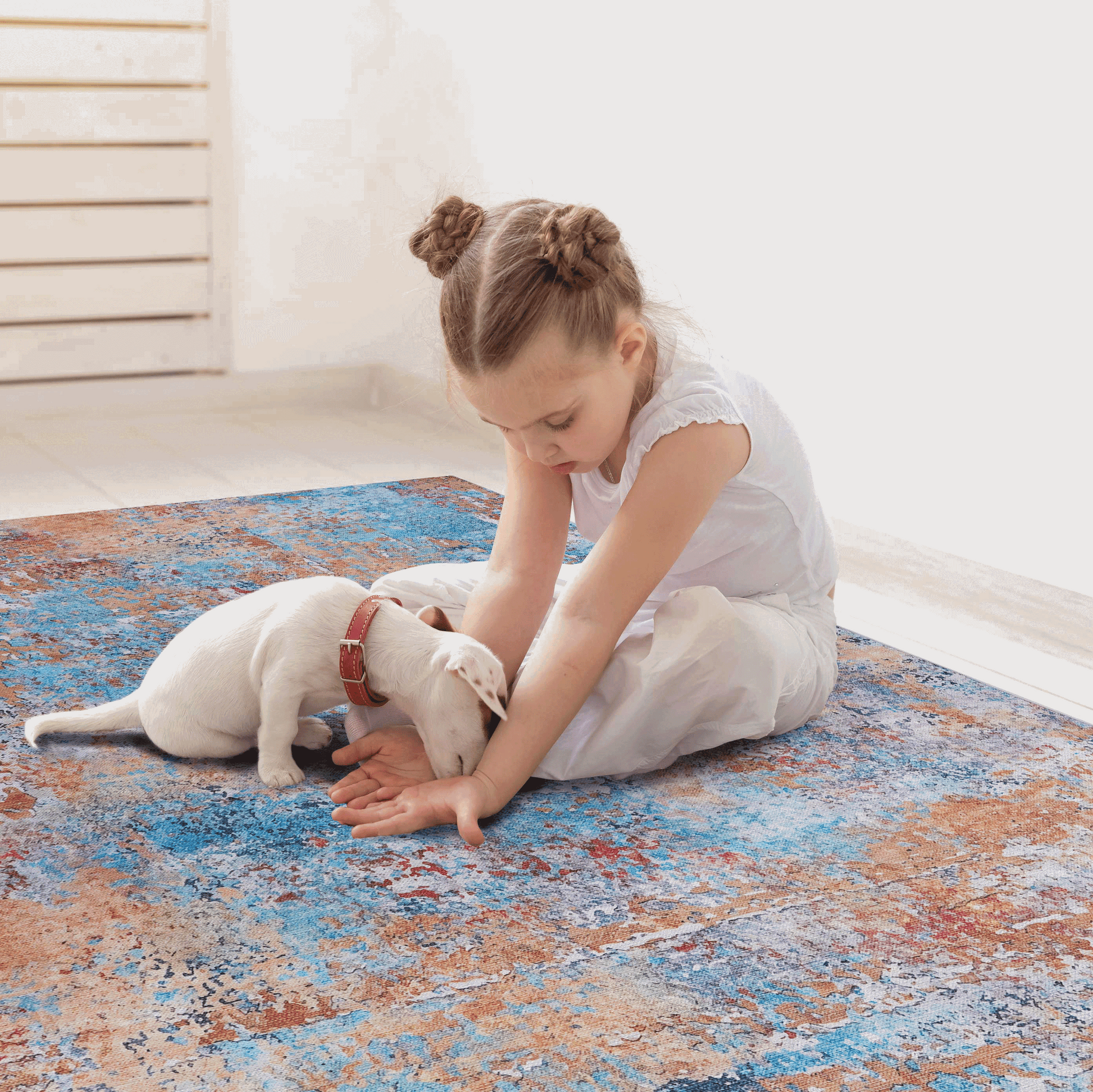 Washable indoor area rug in blue, orange, and gray abstract pattern