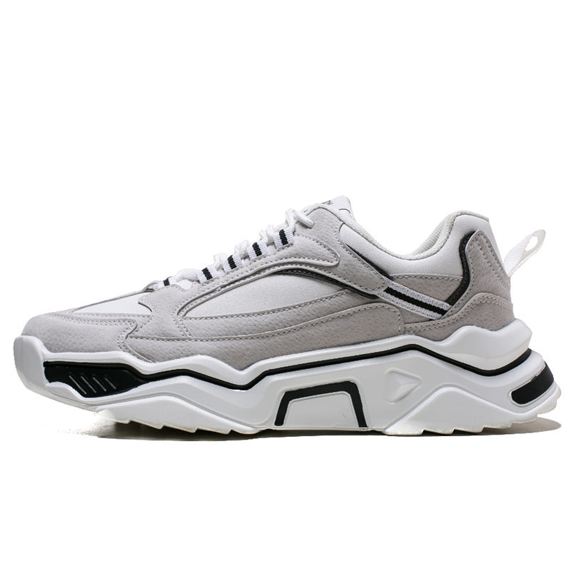 White and gray casual sneaker with black side accents and chunky sole.