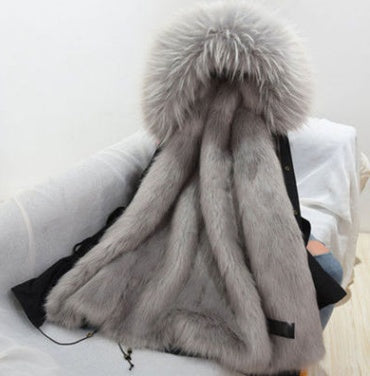 Gray fur coat with a large hood on a white background