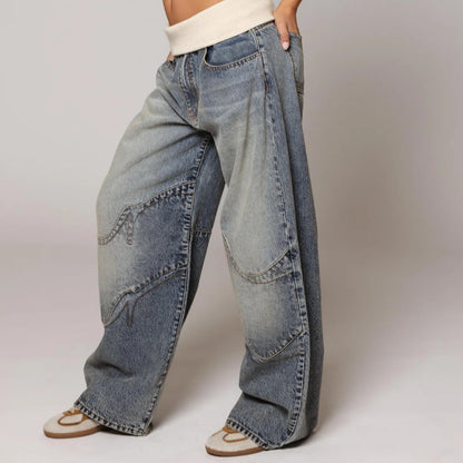Loose straight-leg jeans in light blue denim, side view with patch-style pocket seams