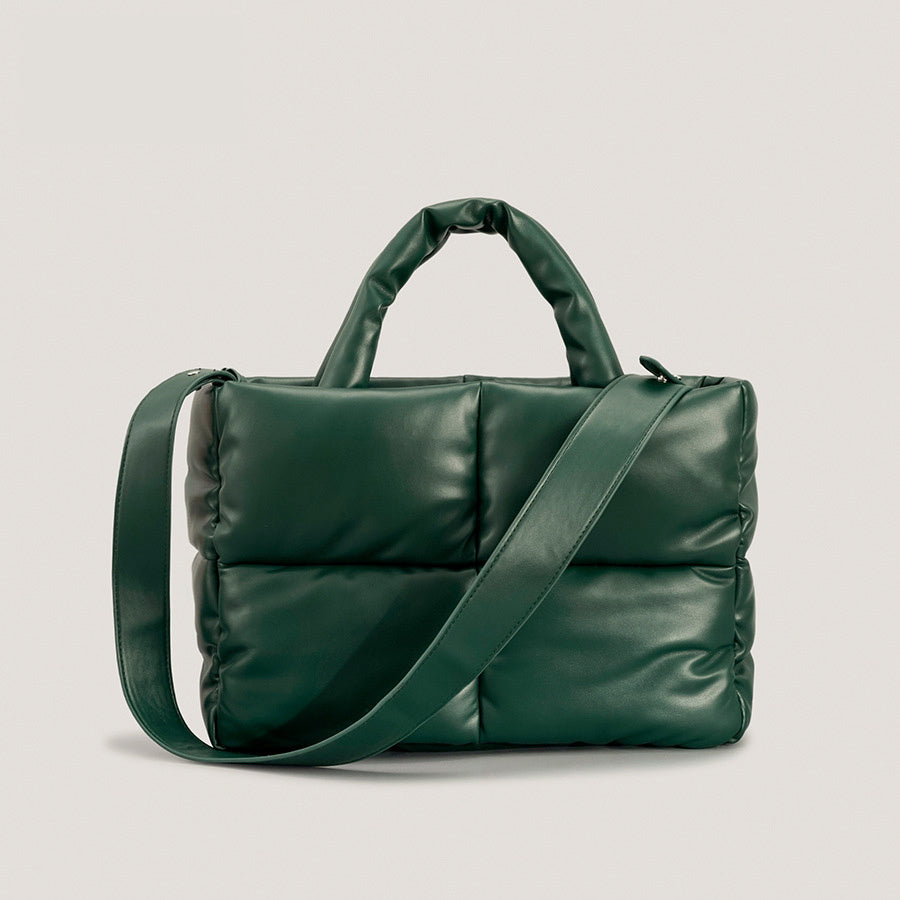 Dark green puffer crossbody handbag with single diagonal strap and top handle