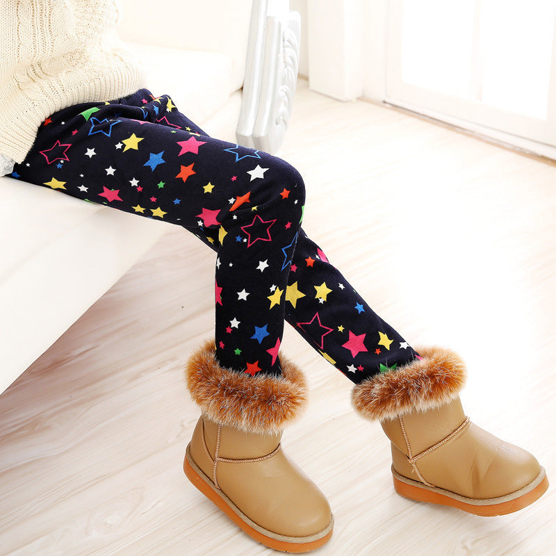 Girls' warm leggings in dark fabric with colorful star print and ribbed cuffs
