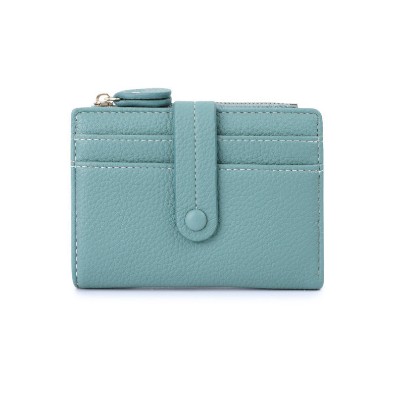 Teal short wallet with card slots, snap button tab, and small coin zipper pocket