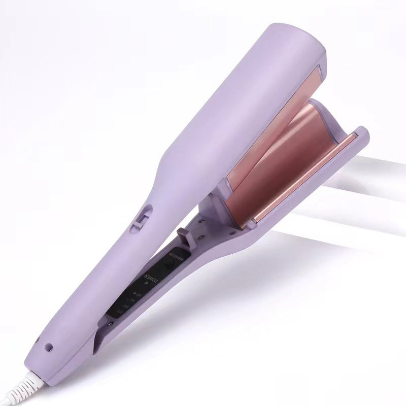 Purple and rose gold hair straightener on a white background