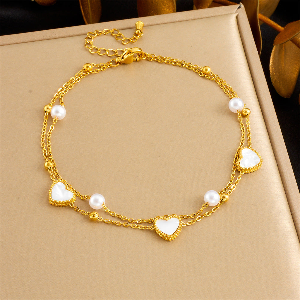 Gold-tone anklet with white heart charms and pearl beads