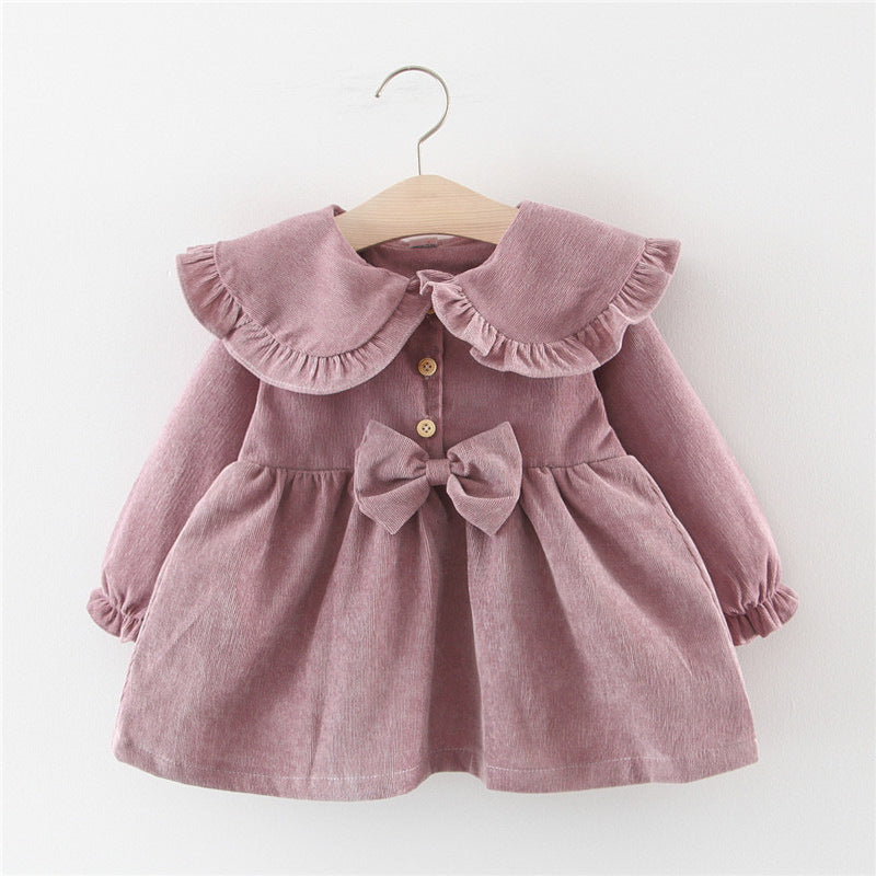 Baby girl dress in dusty mauve with ruffled collar, button front, bow at waist