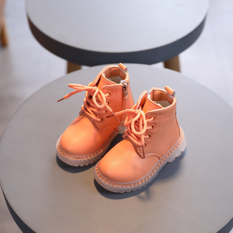 Children's orange lace-up boots with chunky sole and padded ankle