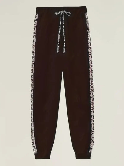 Black jogger pants with leopard print side stripes and drawstring waist