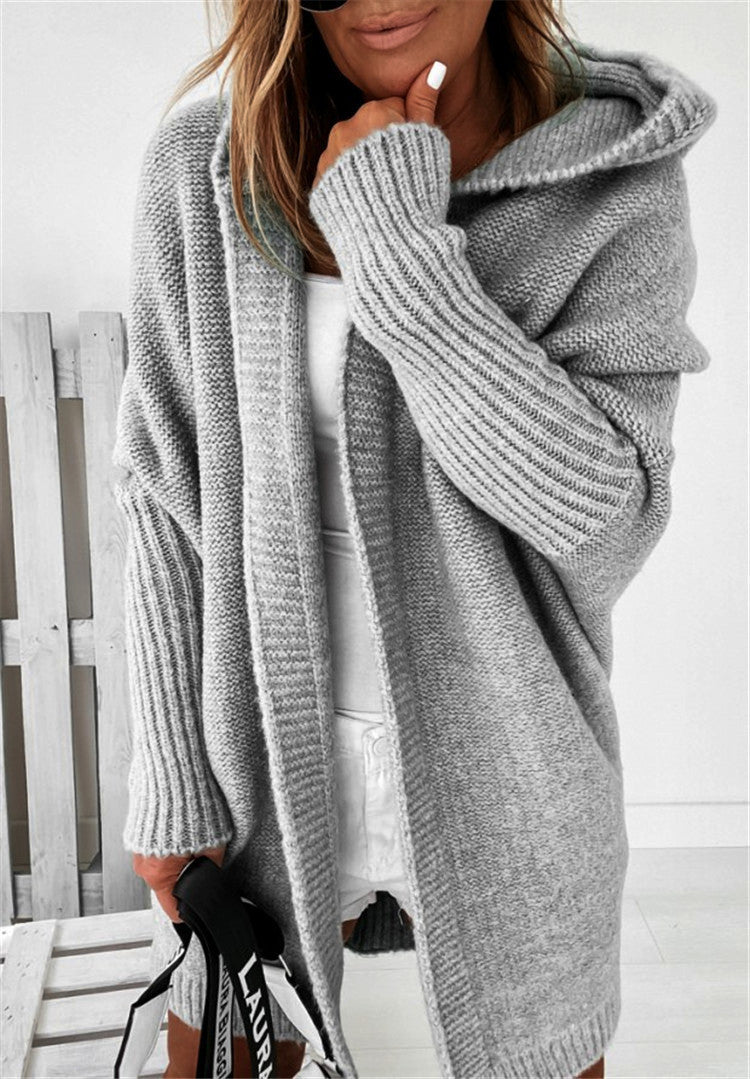 Grey oversized hooded cardigan sweater with batwing sleeves and thick ribbed knit