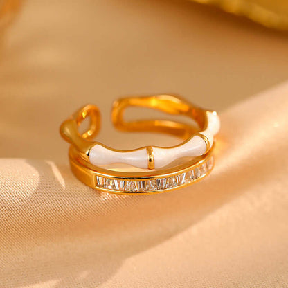 Gold-tone open ring with a row of zircon stones