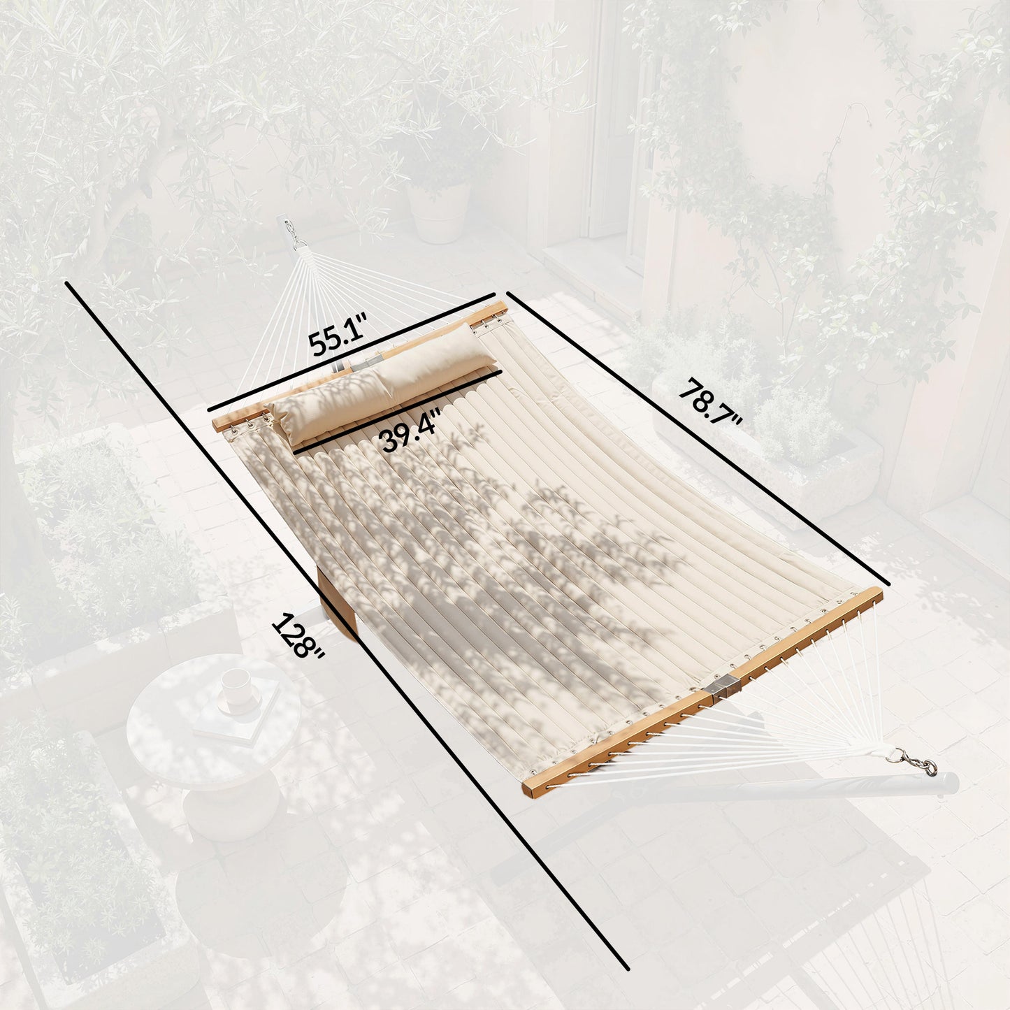 Cream hammock with wooden spreader bars and suspension ropes, padded fabric bed