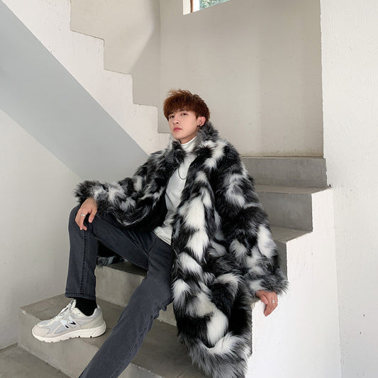 Person wearing a black and white fur coat sitting on a staircase.
