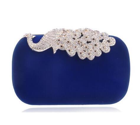 Blue velvet oval clutch bag with silver rhinestone baroque clasp frame