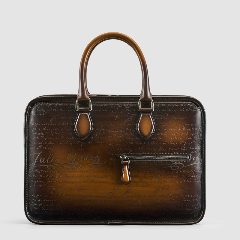 Men's vintage leather business bag in tobacco brown with script embossing and front zip pocket