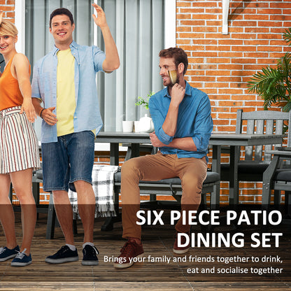 Dark gray patio dining table set with chairs and bench cushions on outdoor deck