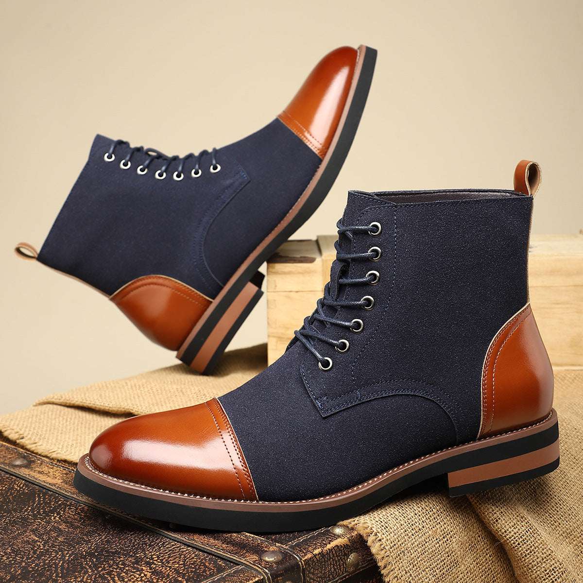Men's navy leather lace-up boots with tan leather toe and side panels