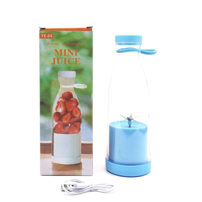 Blue mini juice maker with packaging and accessories on a white background