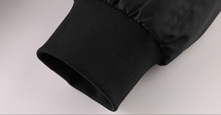 Close-up of a black sleeve on a light gray background