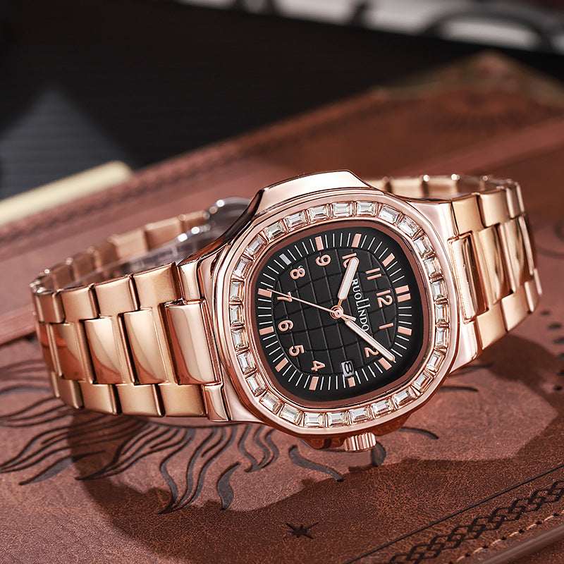 Rose gold tone men's luminous watch with black dial, gold indices and link bracelet