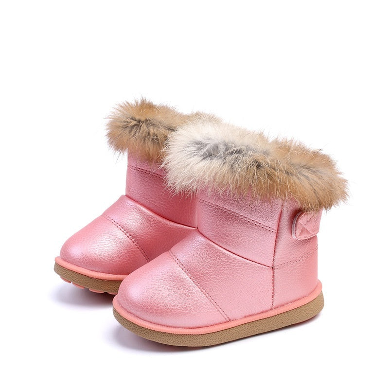 Baby girl snow boots with rabbit fur trim, pink upper and light brown fur cuffs.