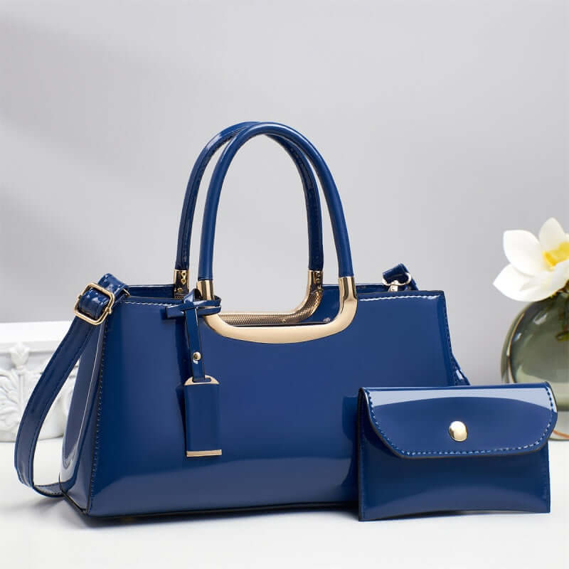 Blue hobo shoulder bag with gold-tone handles and matching flap wallet pouch