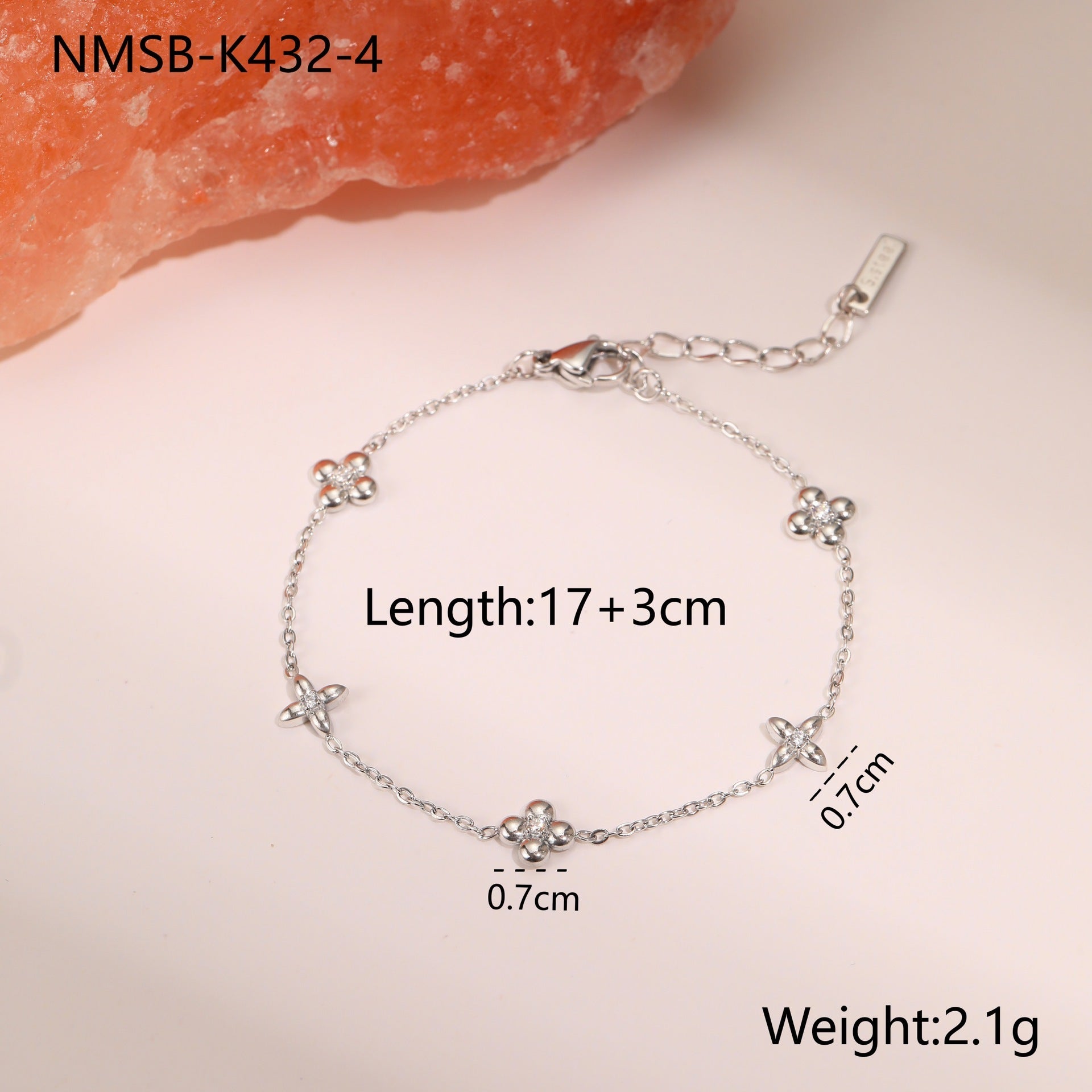 Silver-tone star charm bracelet with small crystal stars and toggle-style clasp