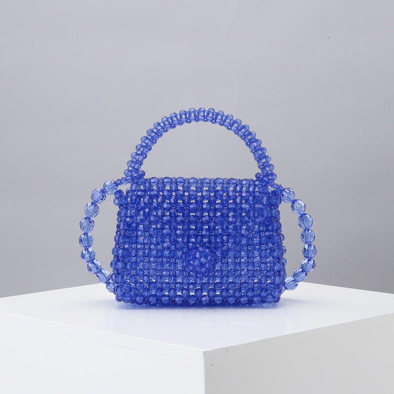 Blue beaded mini tote bag with arched top handle and woven bead mesh