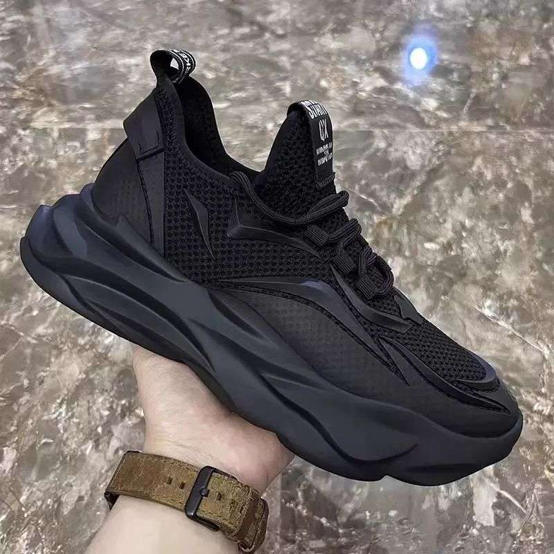Black mesh slip-on sneakers with chunky sculpted sole and lace-up detail