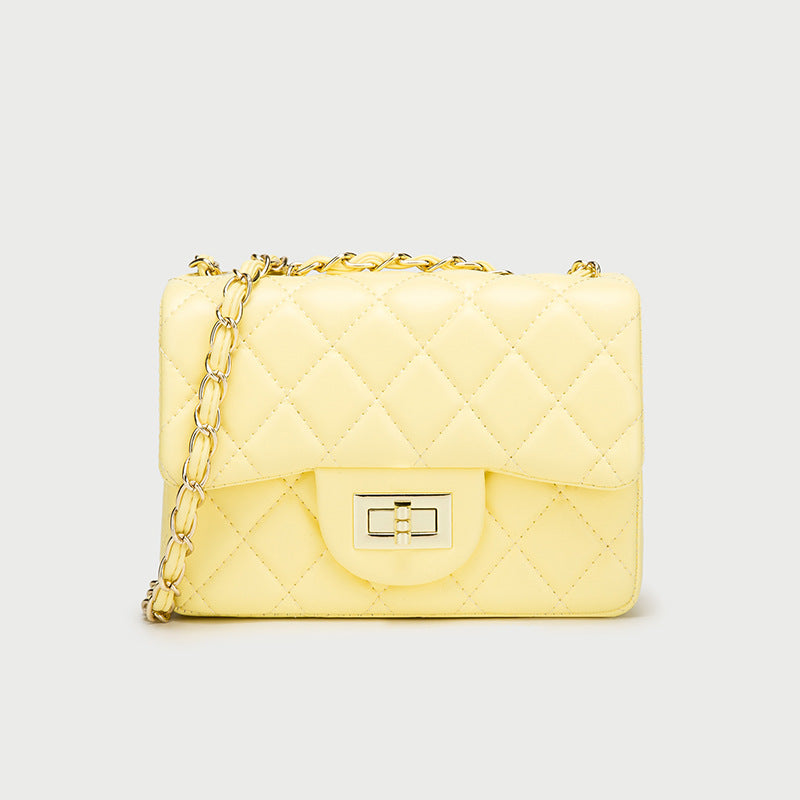 Small one-shoulder messenger bag in pale yellow quilted leather, chain strap, front clasp