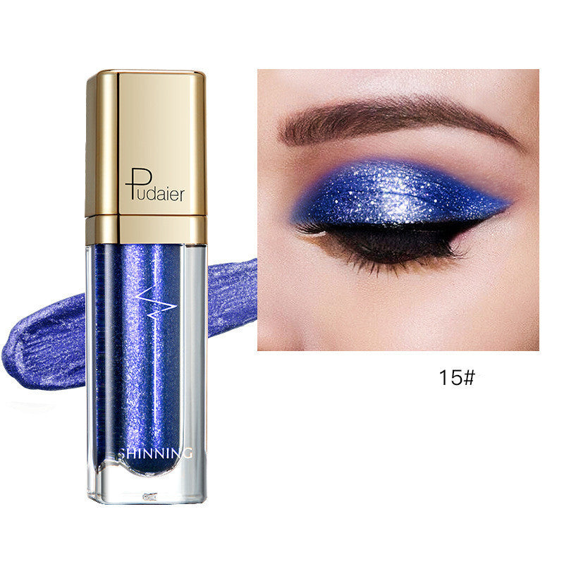 Glitter eyeshadow tube with blue shimmer and matching eyelid swatch, Tudaier
