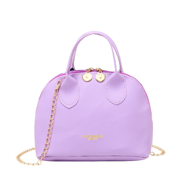 Purple/lavender dome handbag with chain strap and top carry handles